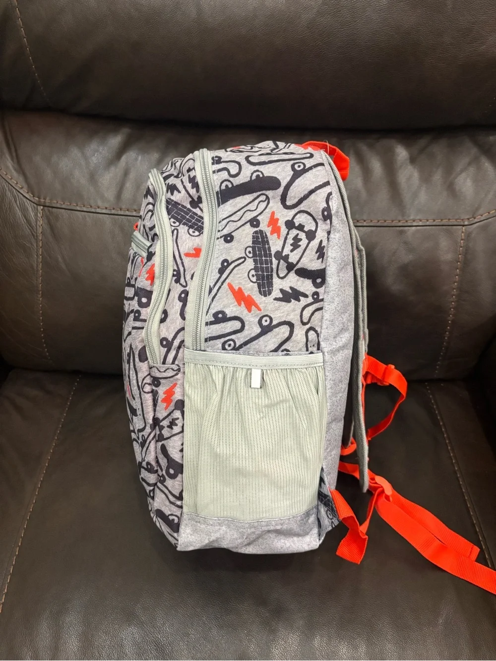 New with tags Kids Skateboard Print Backpack in Gray with Orange Accents